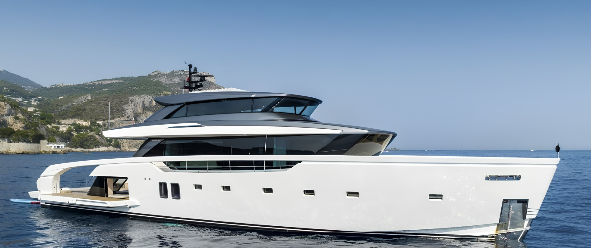 Sleek yacht exterior, expansive windows, modern profile