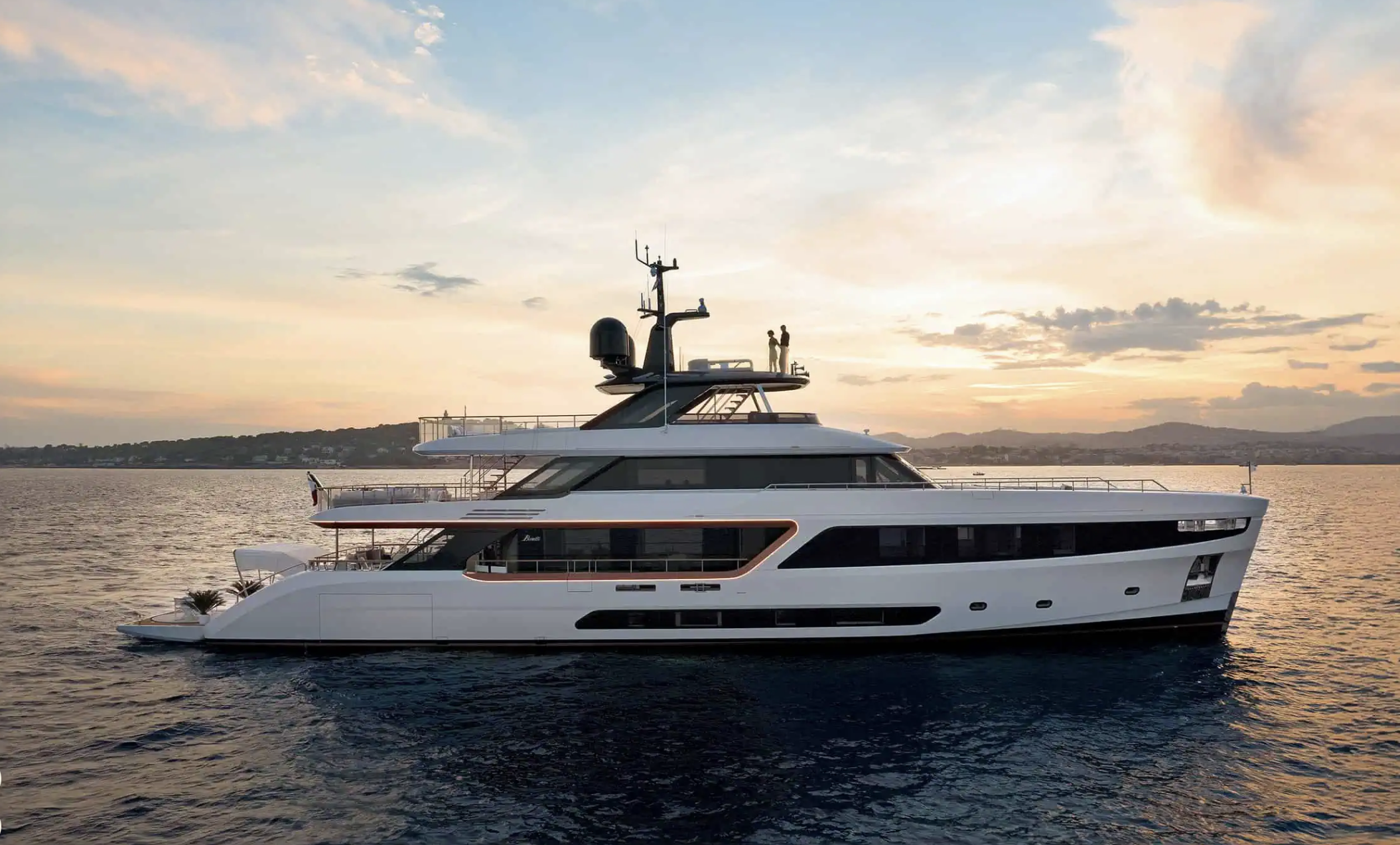 yacht on the water with shore behind